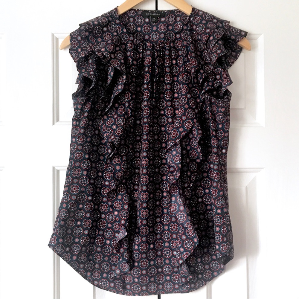 Banana republic ruffle top darling and retro look great for spring/summer look.